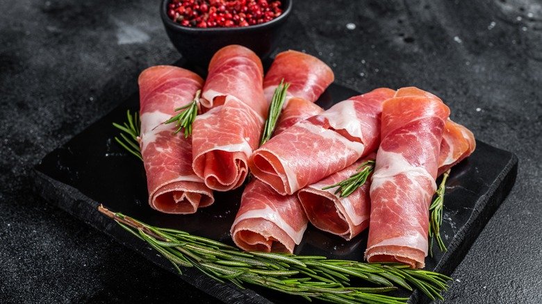 Traditional,Spanish,Jamon,Serrano,Ham,On,Marble,Board.,Black,Background.